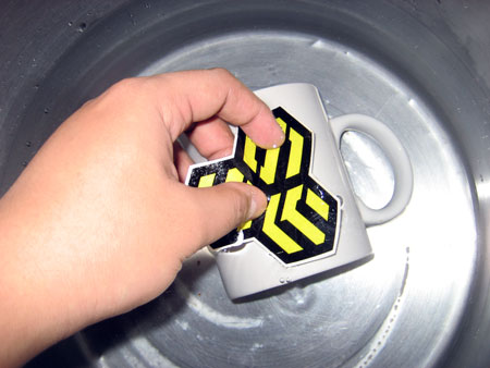 How to create a Personalized Anime Mug submerge mug and decal in a basin of water