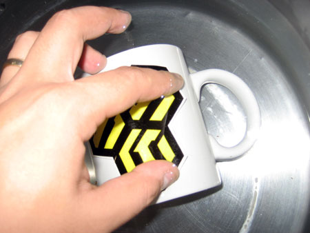 How to create a Personalized Anime Mug, move the decal around gently to release it from the paper