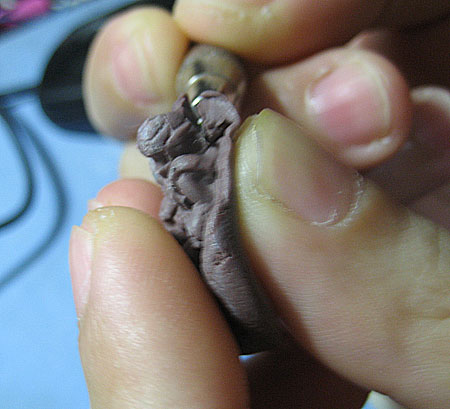 How to make miniature figures using polymer clay mold : using x-acto knife to slice off the excess clay